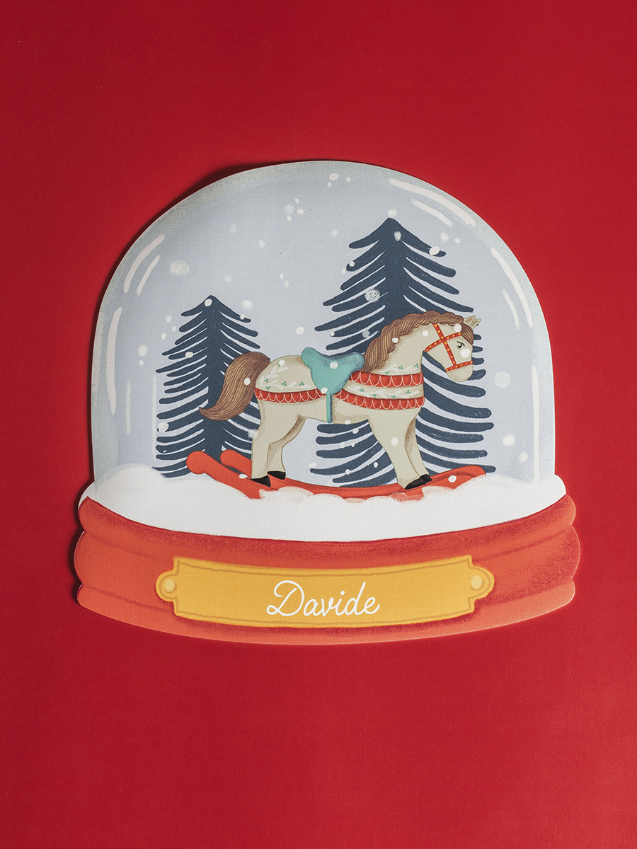 Tovaglietta americana natalizia in vinile con illustrazione palla di neve e cavallino a dondolo Honeycomb Design